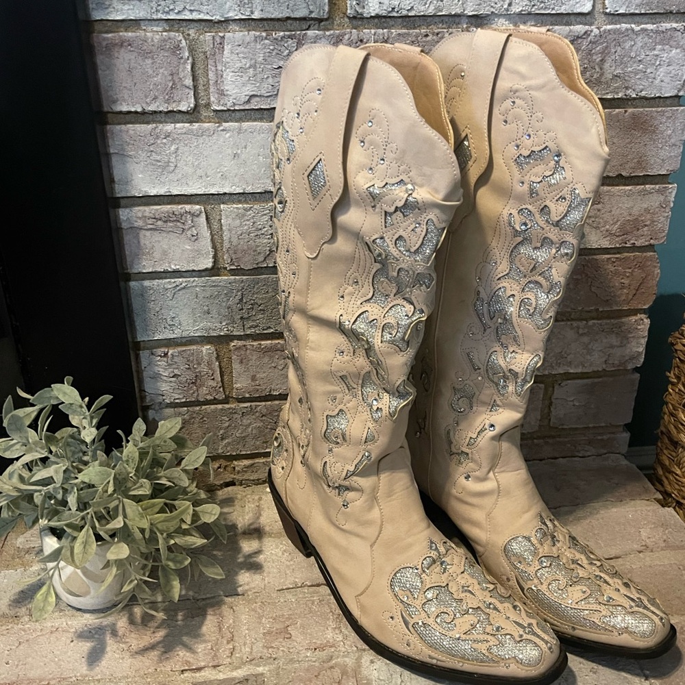 Cowgirl boots!! Sparklingly 
tan and silver. Detailed bling bling!